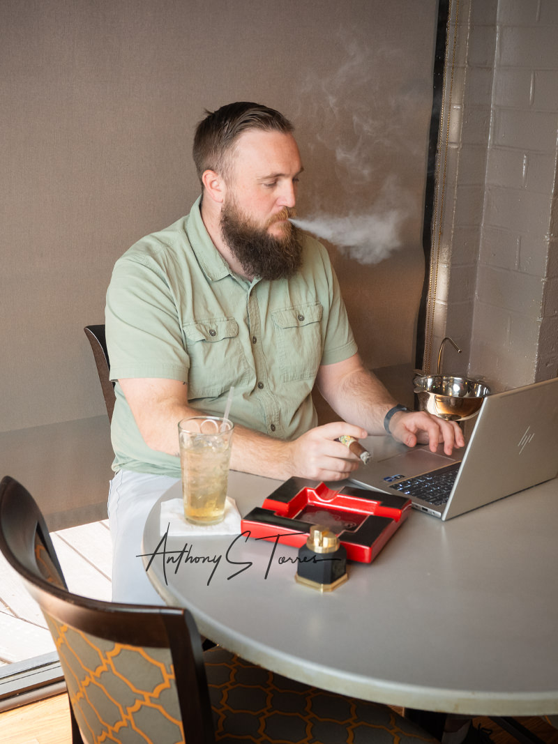 Guest working at the lounge, The Cigar Box NC, Southern Pines NC